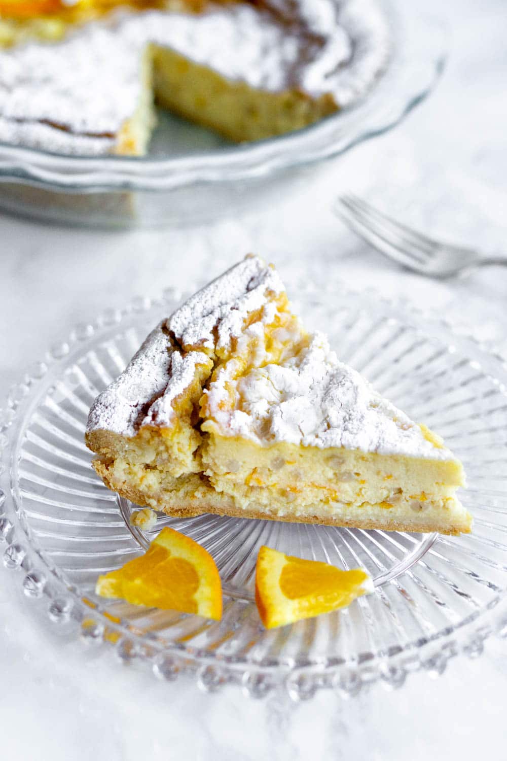 Pastiera Napoletana: Italian Easter pie with ricotta and beautiful orange flavors #pastieranapoletana #easterdesserts #pinacooks #italiandesserts Side shot of slice of pastiera napoletana