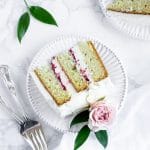 a slice of limoncello cake on a plate with two forks