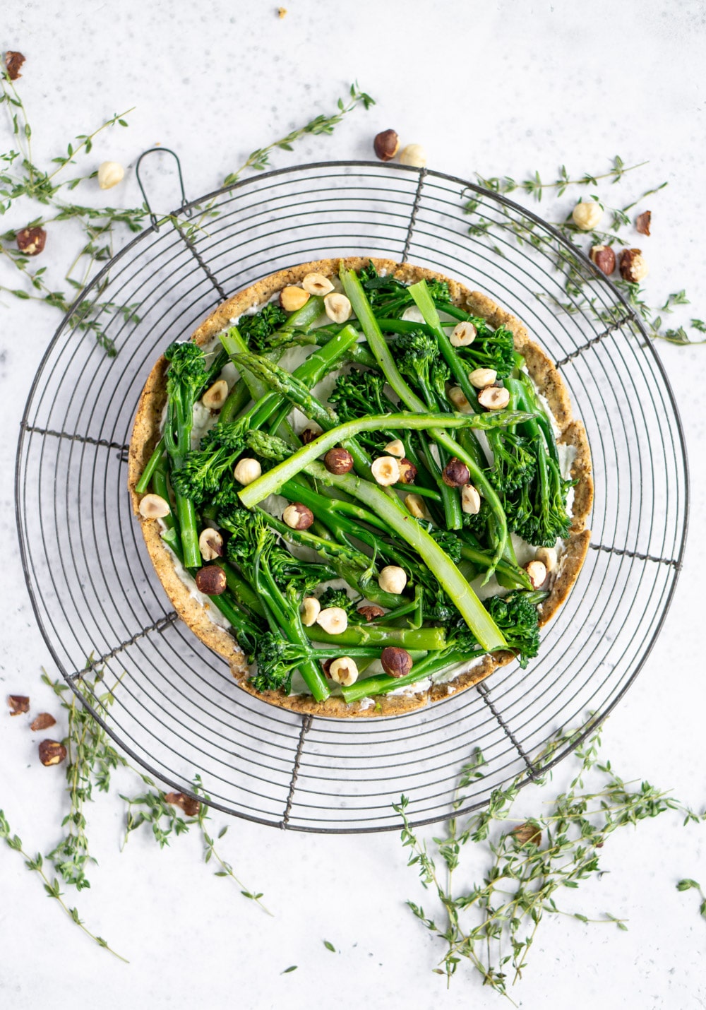 This asparagus and broccolini tart is the perfect make-ahead appetizer! #pinacooks #asparagustart Asparagus and broccolini tart on a cooling rack