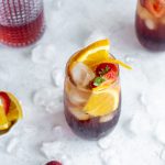 americano cocktail in a glass surrounded by ice cubes
