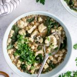 A beautiful vegan soup in a bowl made with lentils, cauliflower and swiss chard