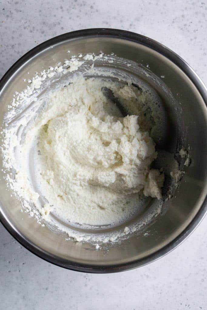 Whipped ricotta in a metal bowl