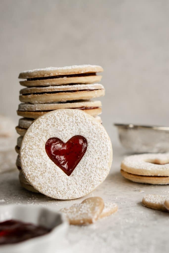 Stacked jam cookies with one cookie in front