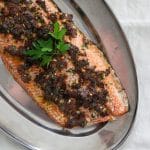 Sun dried tomato salmon on a metal serving tray