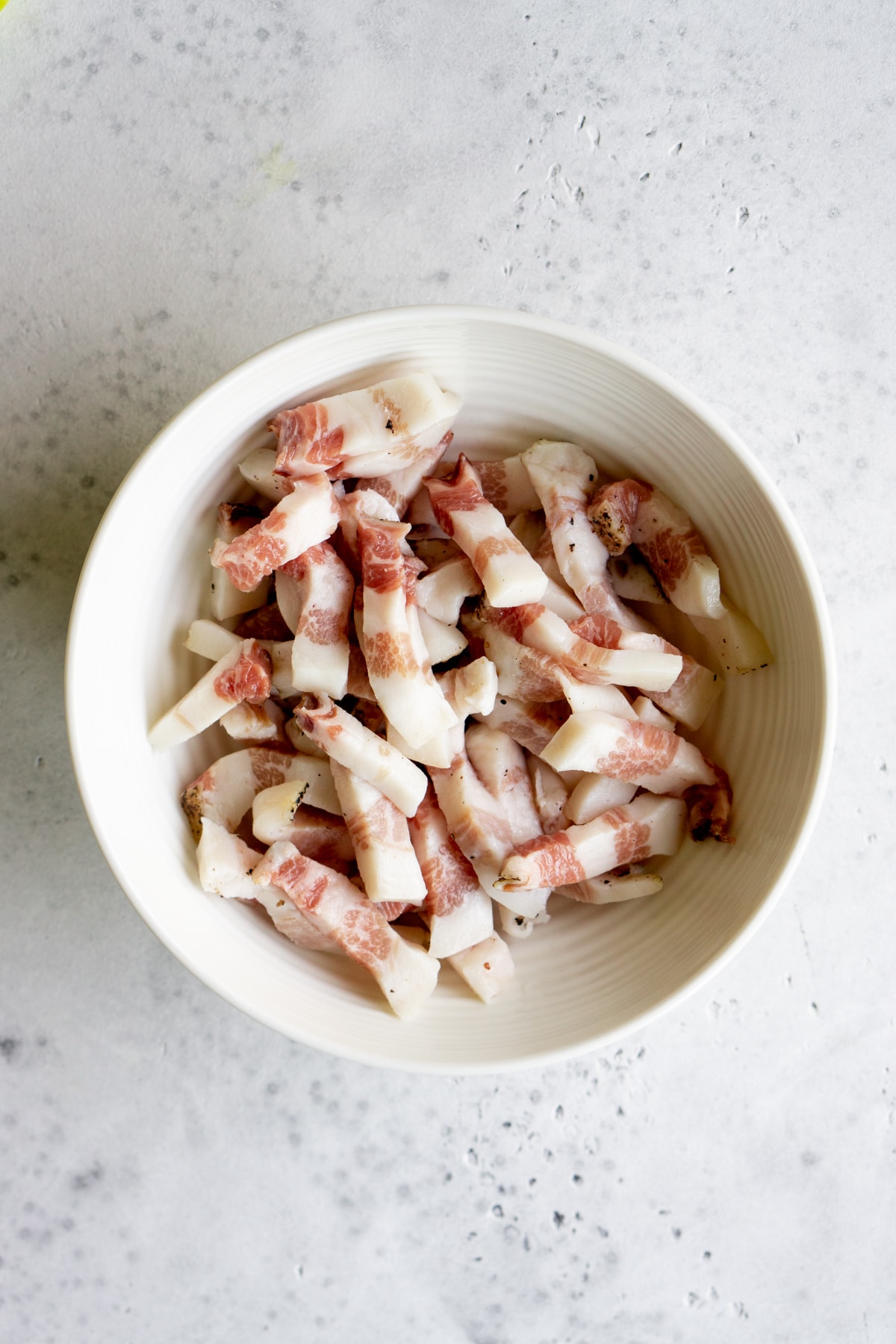 Bowl of guanciale cut into strips