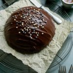 Parrozzo Italian Almond Cake on a drying rack with two espresso iin the background