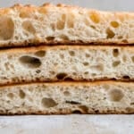 Three pieces of schiacciata stacked on top of one another