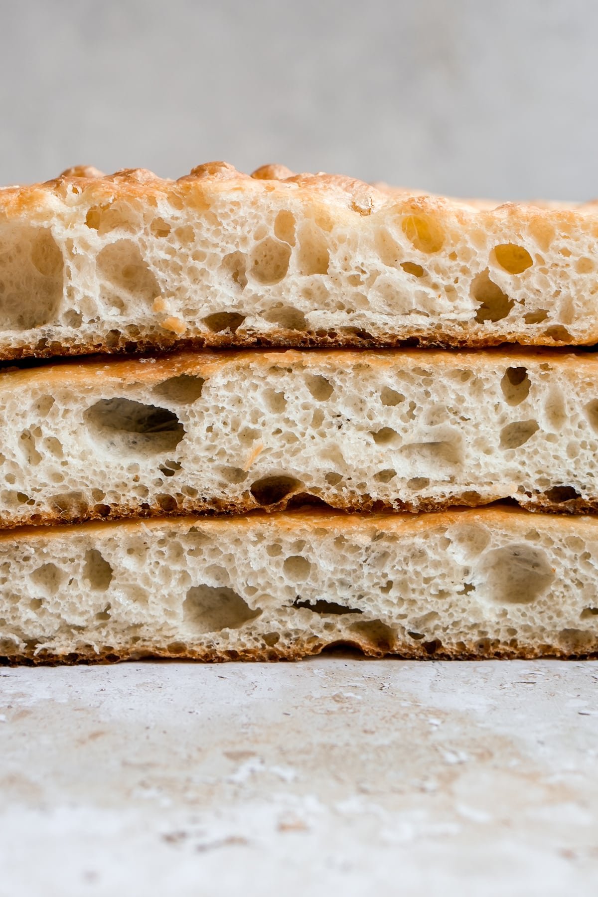 Three pieces of schiacciata stacked on top of one another