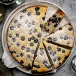 Sliced lemon blueberry ricotta cake in a plate