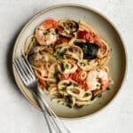 Italian seafood pasta in a dish with forks to the side