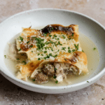 Lasagna in brodo with meatballs and shredded chicken