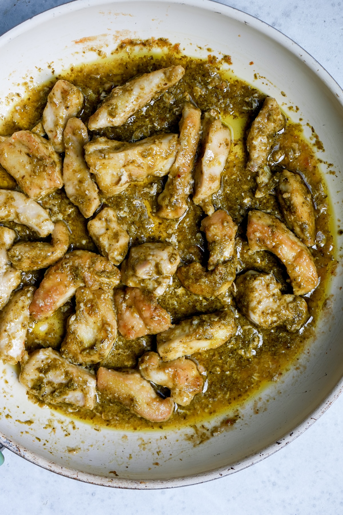 Italian pesto chicken in a skillet