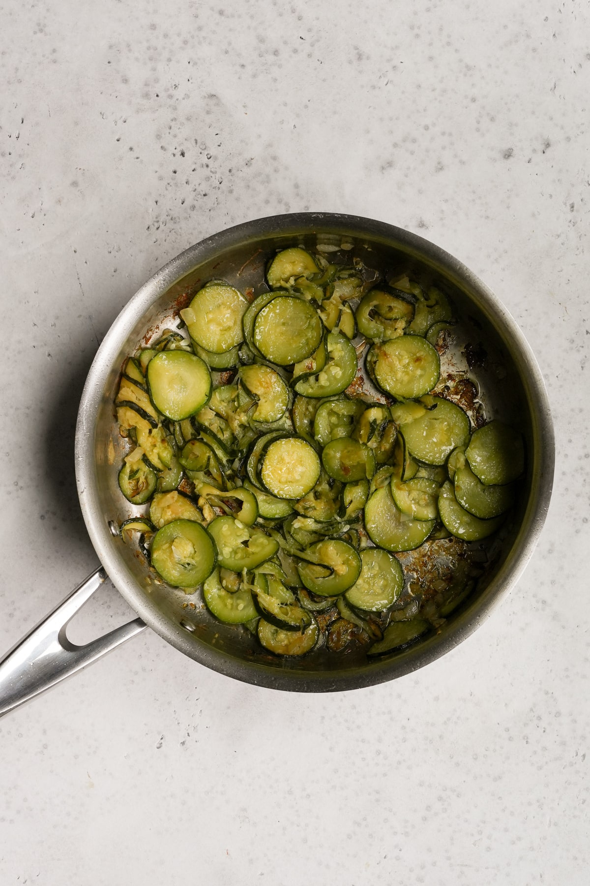 italian farro salad process- sauteed zuchcini in a pan