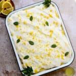 Limoncello tiramisu in a pan topped with lemon zest