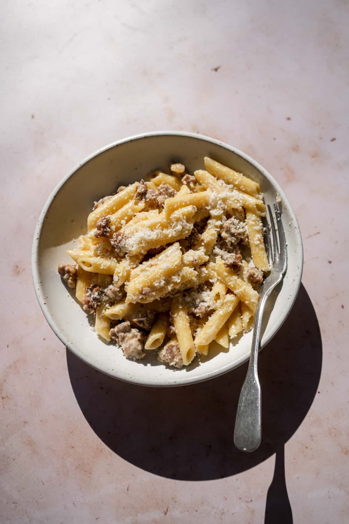 Dish of pasta alla norcina with a fork in it