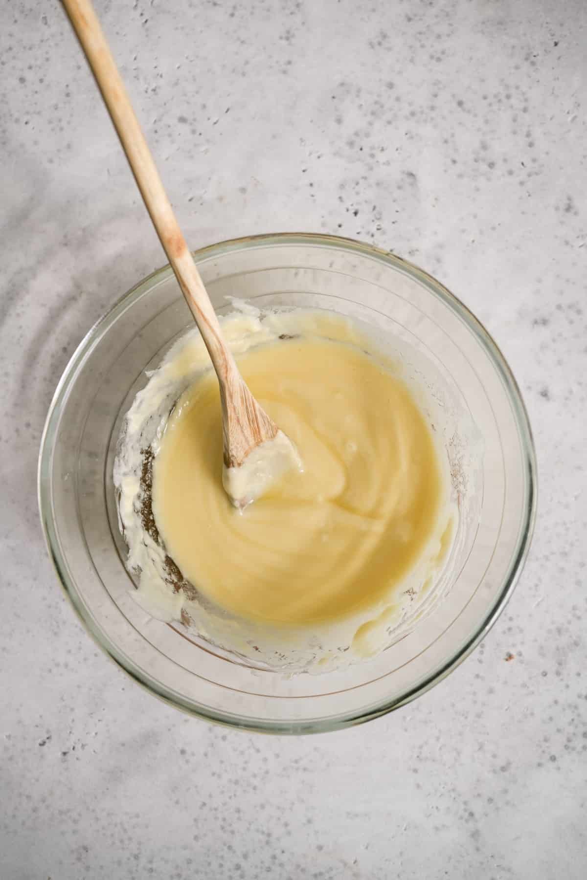 Melted white chocolate and butter in a bowl