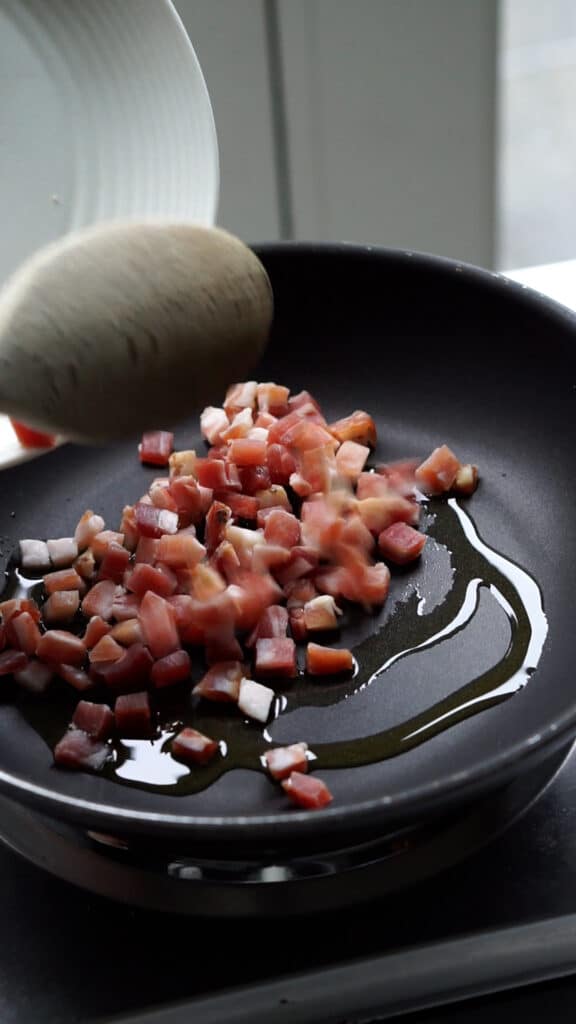 Cubed pancetta in a pan