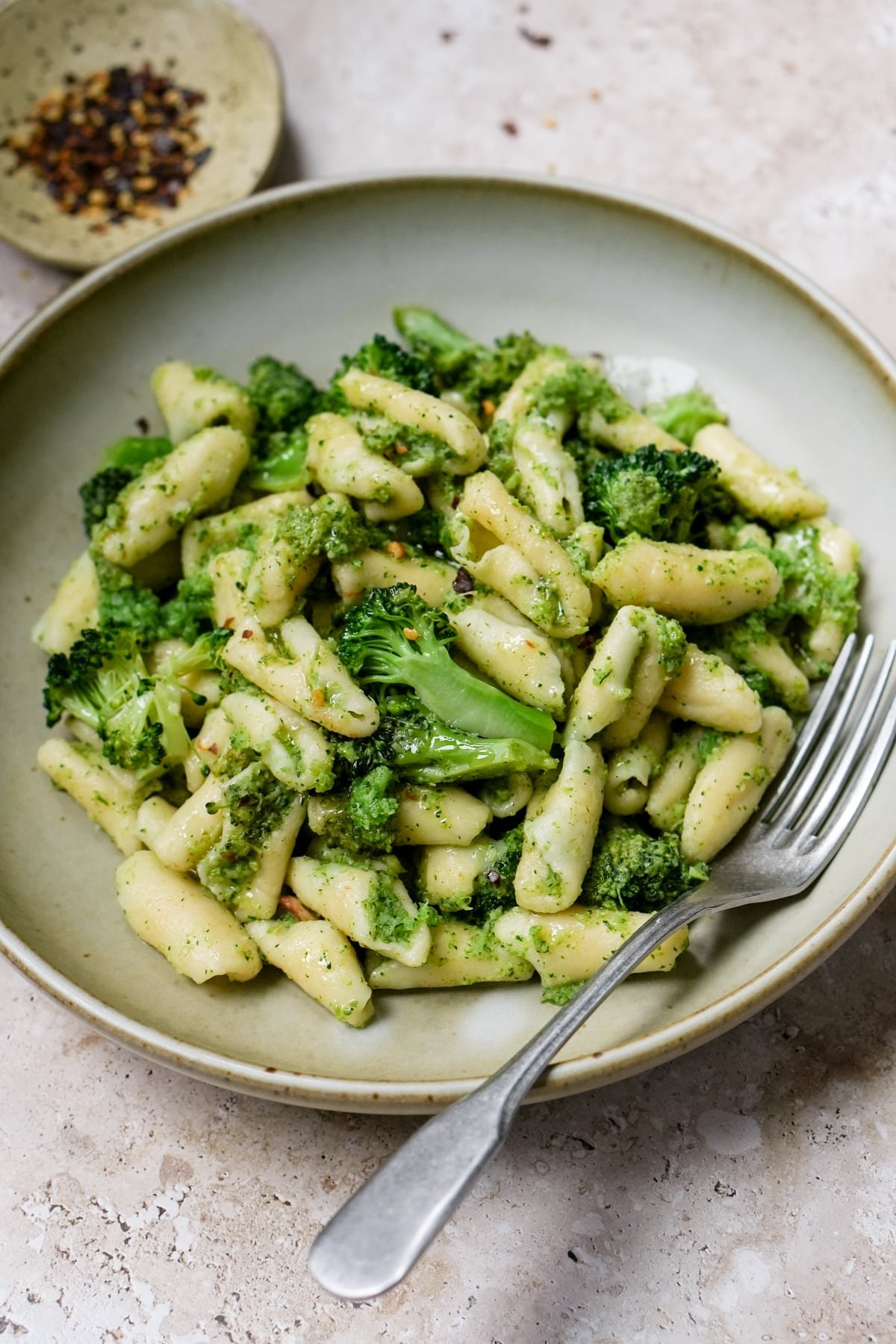 Cavatelli and broccoli in a plate with a fork to the side