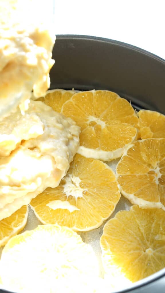 Adding batter to cake pan