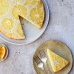 Orange upside down cake with a piece cut out of it
