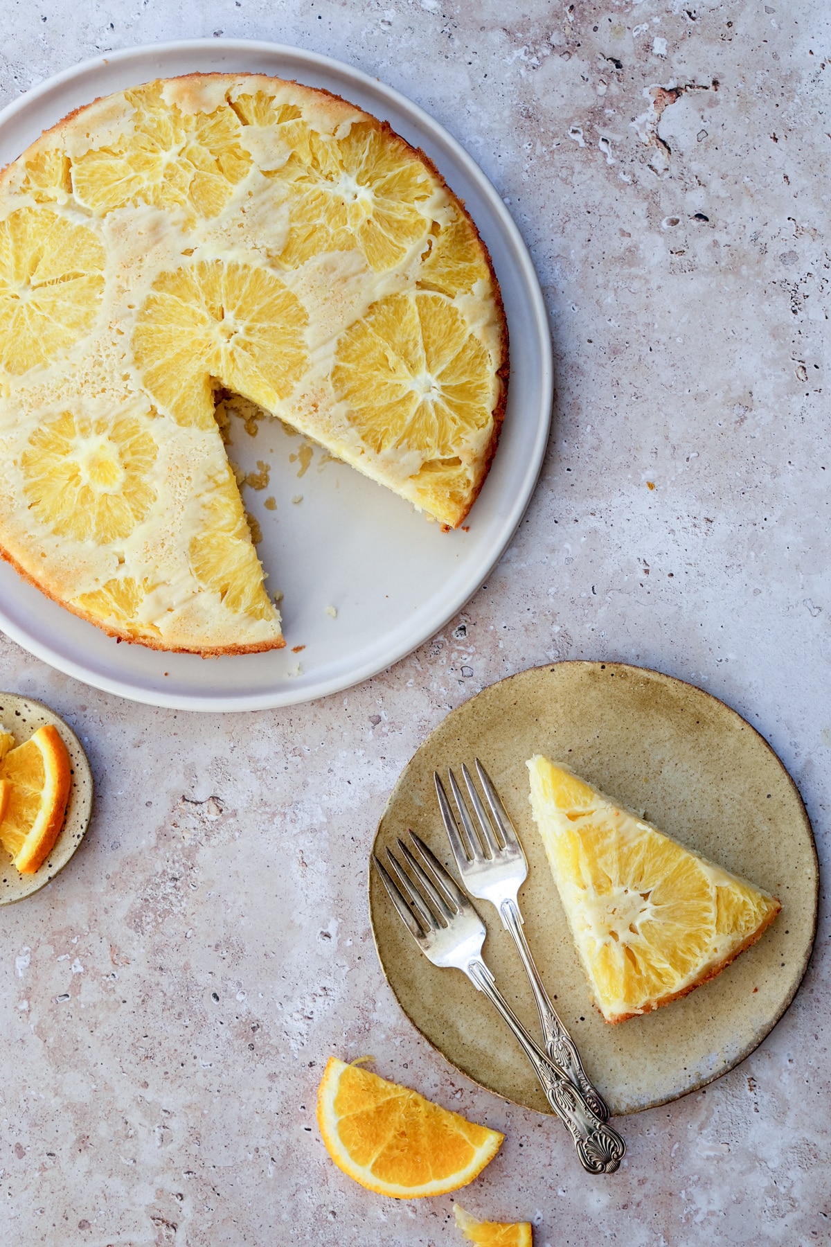 Orange upside down cake with a piece cut out of it
