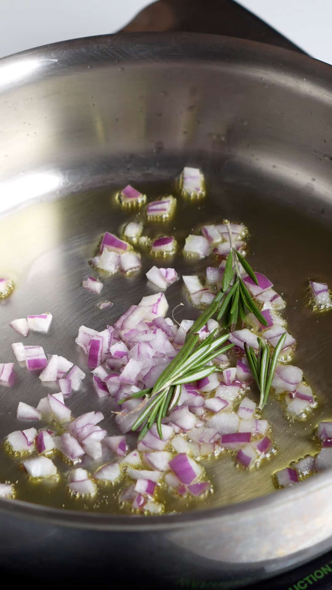 Step by step photos on how to make vegan barley soup - sautee onions and rosemary