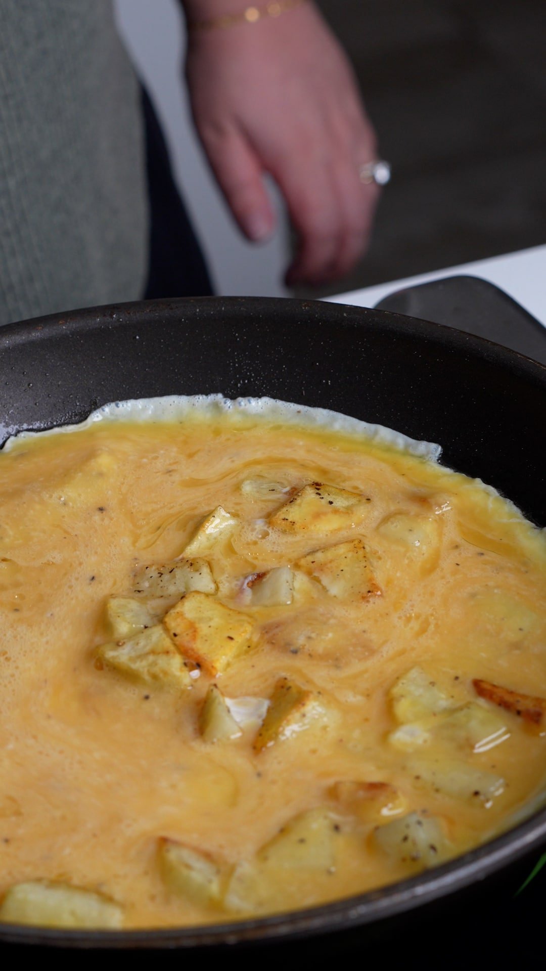 Step by step photos on how to make potato frittata - step 2 - add the eggs to the potatoes and cook