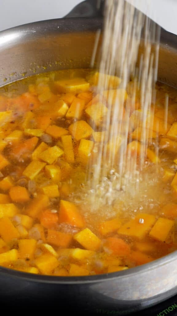 Step by step photos on how to make vegan barley soup - add the barley