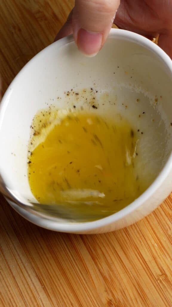 How to make Italian fennel salad (step 4) - mix the dressing with a fork