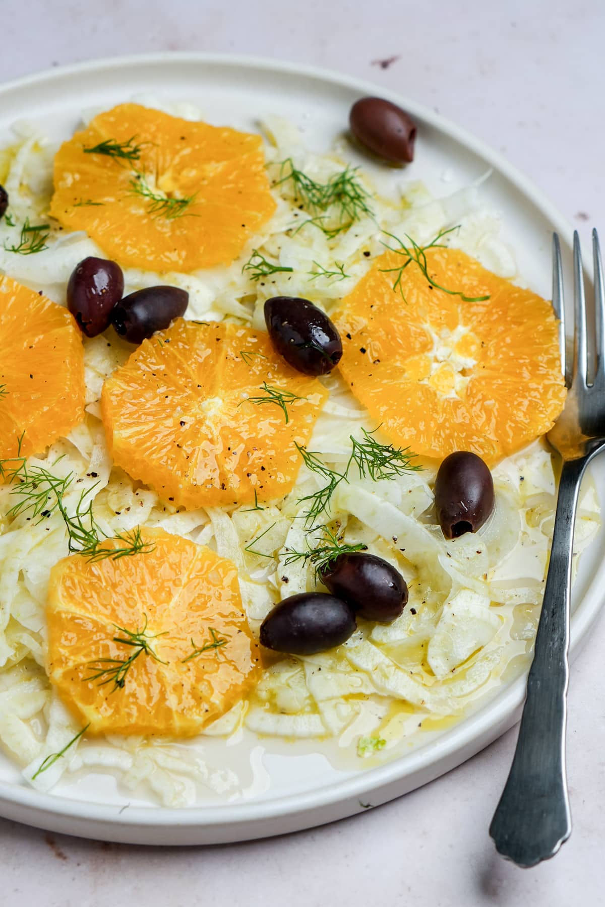 Italian fennel salad in a plate with oranges and black olives