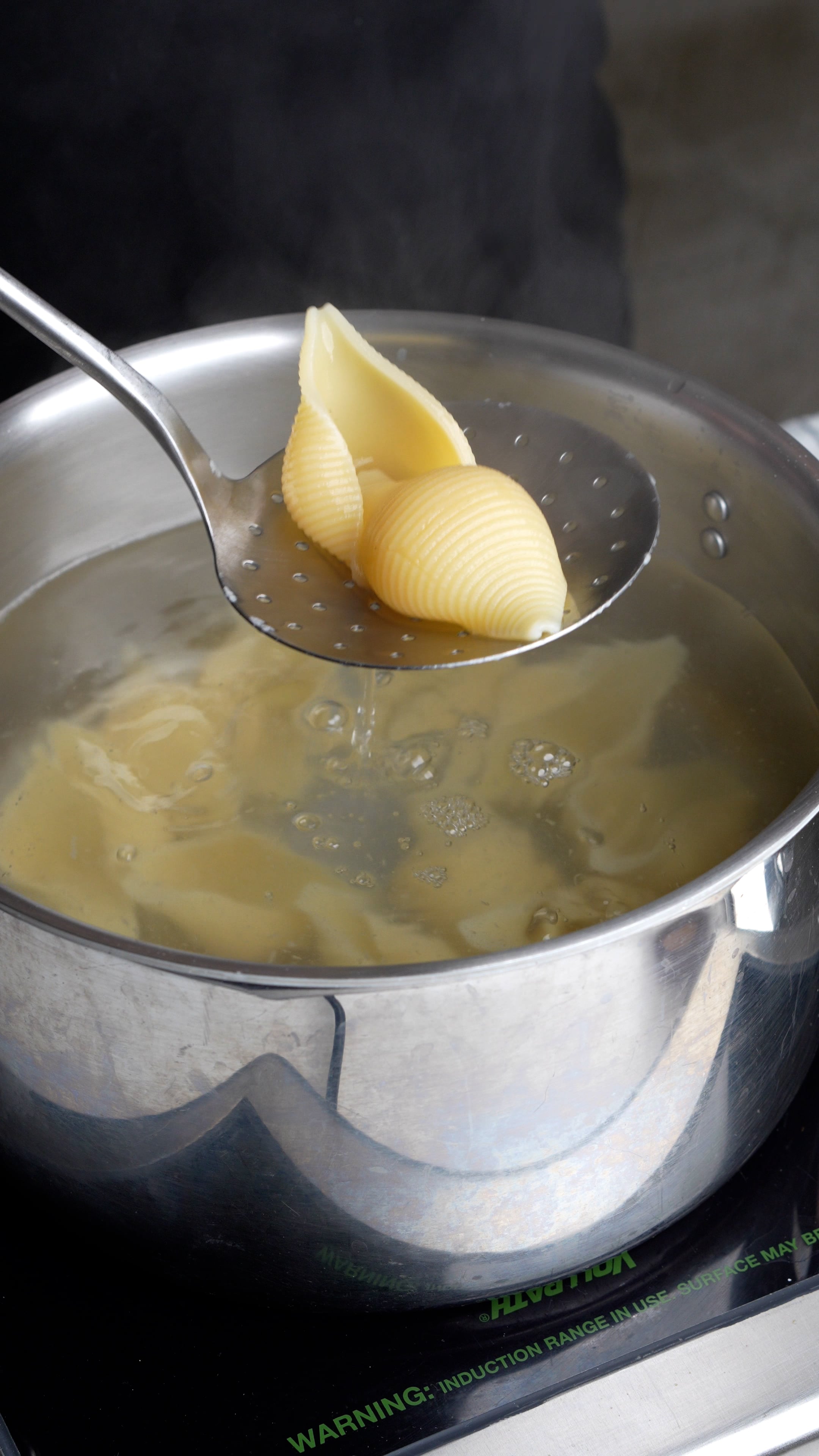 Step by step process on how to make butternut squash-stuffed shells (step 1 - boil the pasta shells)