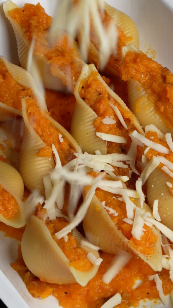 Step by step process on how to make butternut squash-stuffed shells (step 5 - stuff the shells and top with mozzarella)