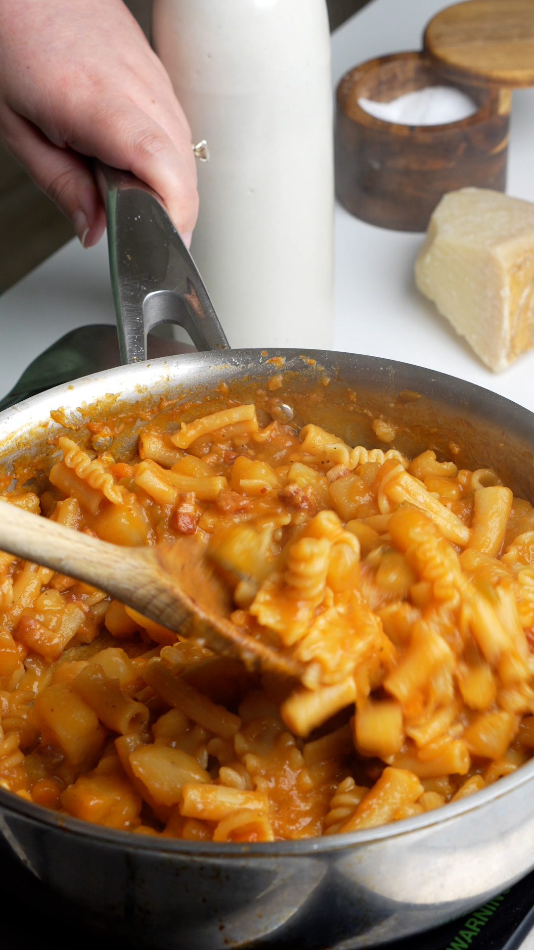 Pasta e patate being mixed in pan