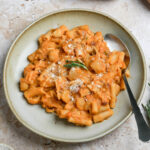 Italian pasta and potatoes in a bowl with a spoon