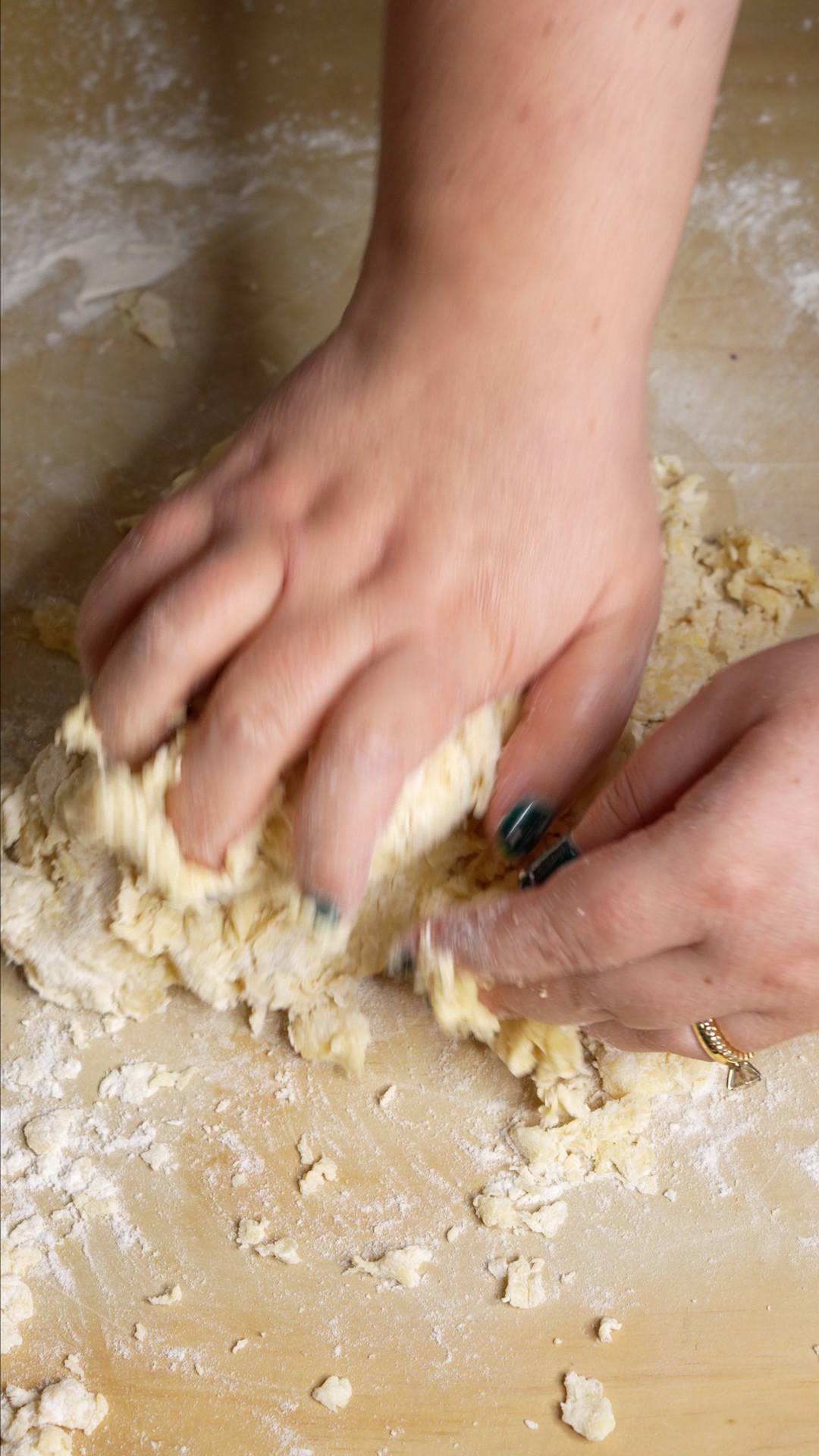 Kneading dough on wooden board