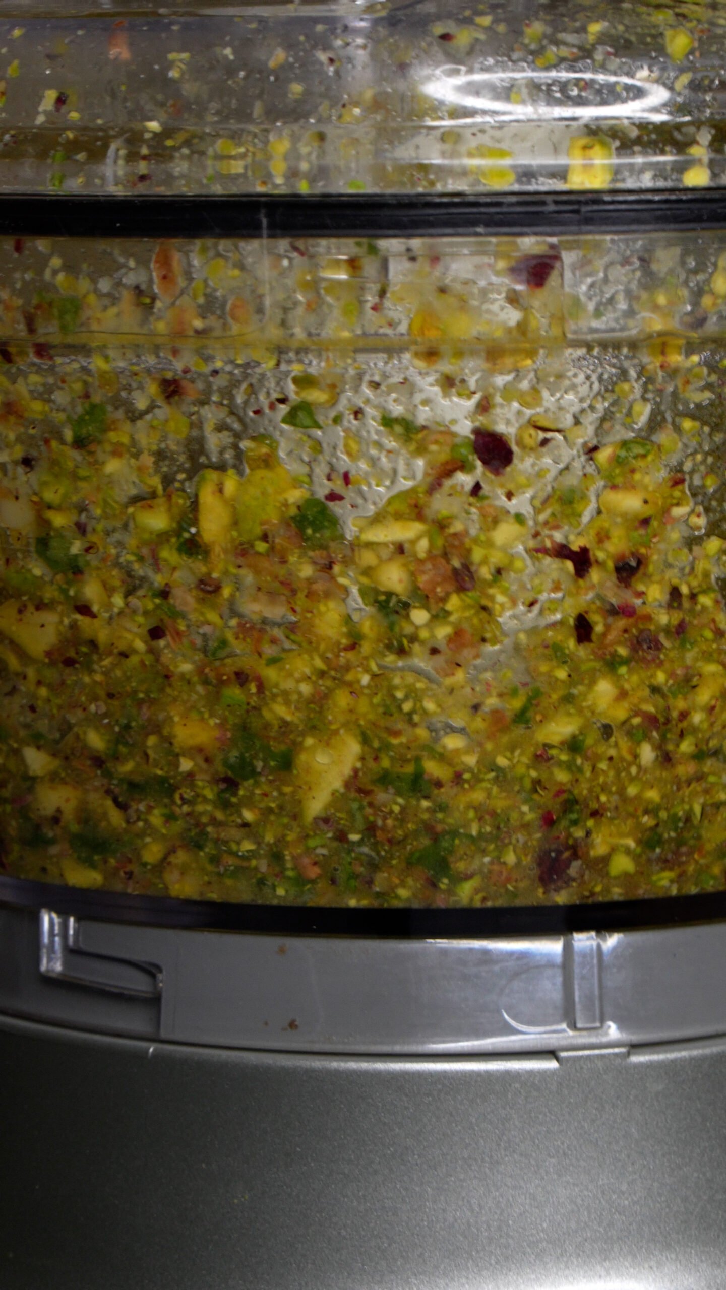 Pistachio pesto being blended up in food processor