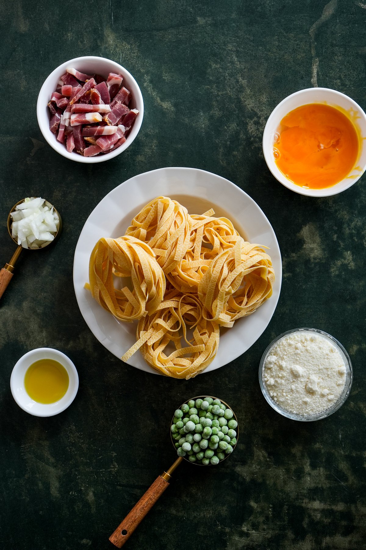 Papalina ingredients - egg fettuccine, sliced prosciutto, eggs, parmigiano reggiano, peas, olive oil, chopped onions