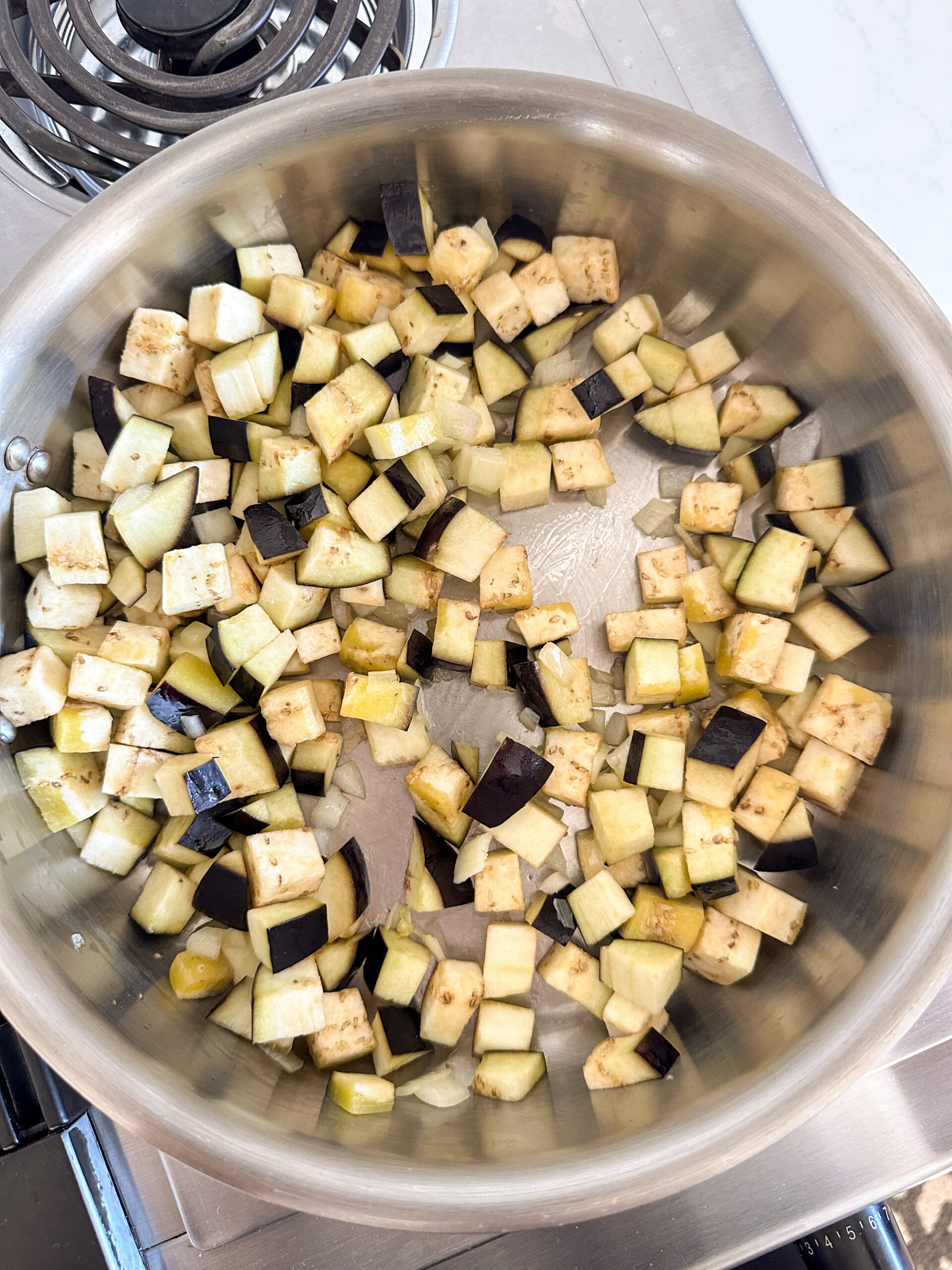 diced eggplant in a pan