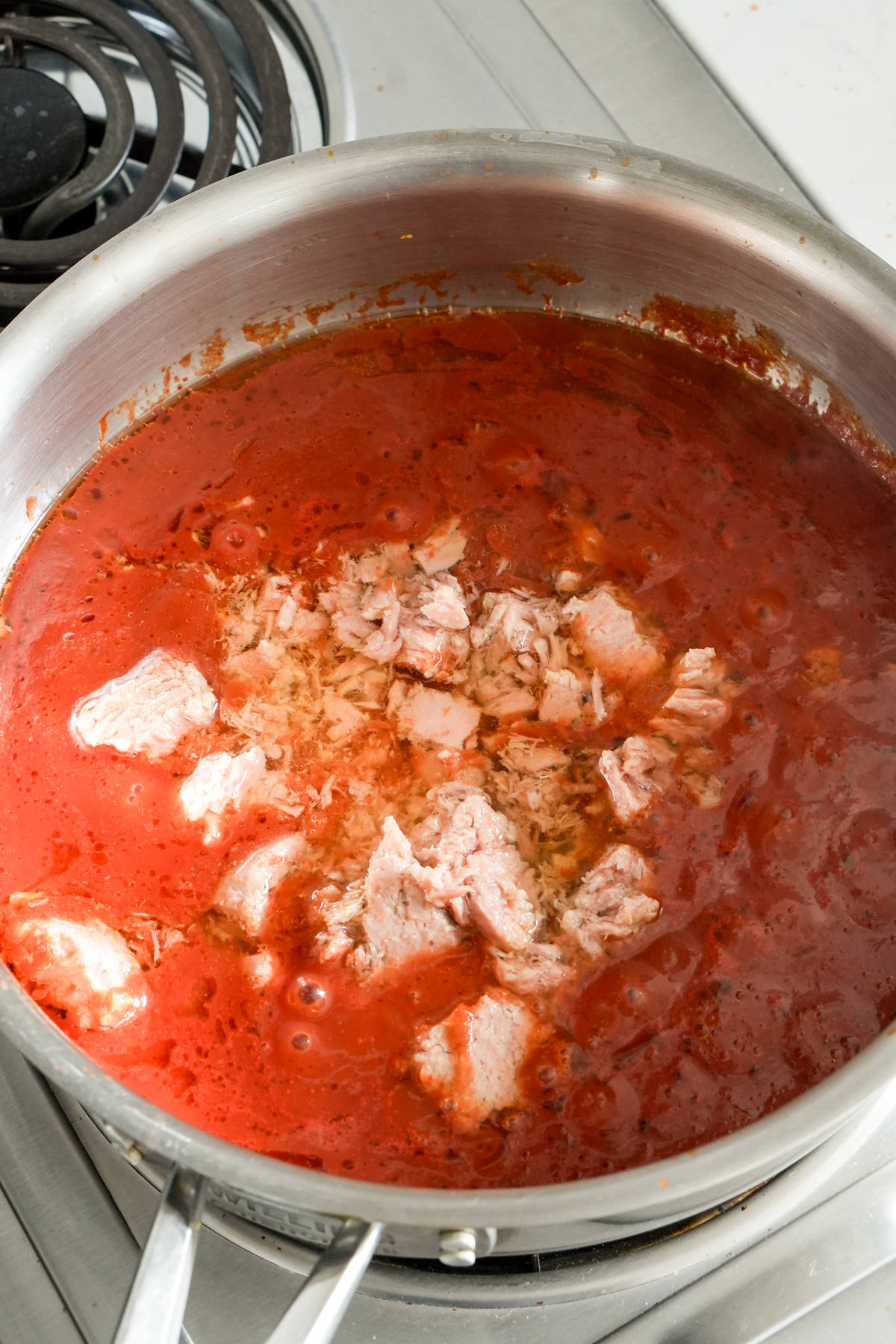 Tomato sauce with canned tuna in a pan